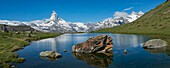 Switzerland, Valais, Zermatt, not far from the summit of the cable car Blauherd, panoramic view of Lake Stellisée, mirror of the Matterhorn