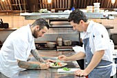 Canada, New Brunswick, Acadie, Moncton, Little Louis restaurant, chef Pierre A. Richard (right) in the kitchen and his chef Jonathan Morrisson