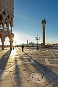 Italy, Veneto, Venice listed as World Heritage by UNESCO, San Marco district, Saint Mark's tiny Square (Piazzetta San Marco), the Palazzo Ducale (Doge's palace), the column headed with the Lion of Venice, the basilica and abbey church of San Giorgio Maggiore in the background