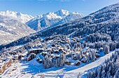 France, Savoie, Tarentaise valley, La Tania is one of the largest skiresort village in France, in the heart of Les Trois Vallees (The Three Valleys), one of the biggest ski areas in the world with 600km of marked trails, western part of the Vanoise Massif, view of the Grand Bec Peak (3398m) in Parc National de La Vanoise (aerial view)