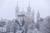 France, Rhone, Lyon, 5th district, Fourviere district, Notre Dame de Fourviere basilica (XIXth century), listed as a Historic Monument, listed as World Heritage by UNESCO site under the snow