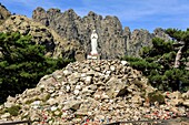 France, Corse du Sud, Quenza, Col de Bavella, Our Lady of the Snow, white virgin of Alta Rocca, Needles of Bavella in the background