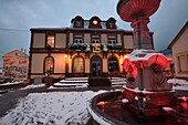 France, Vosges, Plainfaing, city hall dating from 1870, fountain, illuminations evening