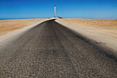 Morocco, Western Sahara, Dakhla, lighthouse standing at the end of a road crossing the desert