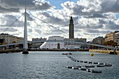 France, Seine Maritime, Le Havre, Downtown rebuilt by Auguste Perret listed as World Heritage by UNESCO, Perret buildings around the Bassin du Commerce, the footbridge, the Volcan created by Oscar Niemeyer and the Lantern tower of Saint Joseph church