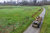 France, Eure, Sainte Colombe prés Vernon, Allied Reconstitution Group (US World War 2 and french Maquis historical reconstruction Association), reenactors in uniform of the 101st US Airborne Division progressing in a jeep Willys (aerial view)