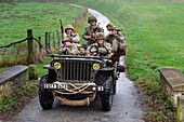 France, Eure, Sainte Colombe prés Vernon, Allied Reconstitution Group (US World War 2 and french Maquis historical reconstruction Association), reenactors in uniform of the 101st US Airborne Division progressing in a jeep Willys