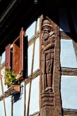 France, Haut Rhin, Kientzheim, house, wooden sculptured bas relief.