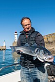 France, Morbihan, Belle-Ile island, le Palais, fishing guide and instructor Arnaud de Wildenberg returning to port