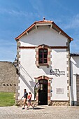France, Morbihan, Guemene-sur-Scorff, the tourist office and the entrance to visit the medieval bath of the Queen's Baths