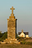 France, Morbihan, Hoedic, Calvary of Port Blanc and Notre Dame la Blanche church in the background