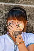 Myanmar (Burma), Mandalay region, Buddhist archeological site of Bagan, young Burmese with Thanaka on the cheeks