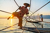 Myanmar (Burma), Shan State, Inle Lake, Intha fishermen with their conical net