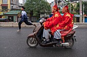 Vietnam, Bat Trang, near Hanoi, ceramist village, monks on a bike