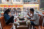 Vietnam, Lao Cai province, Sa Pa town, Vietnamese couple at the restaurant