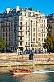 France, Paris, the banks of the Seine and a boat Riva for tourism
