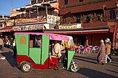 Morocco, High Atlas, Marrakesh, Imperial City, medina listed as World Heritage by UNESCO, Jemaa El Fna square, Auto rickshaw