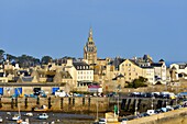 France, Finistere, Roscoff, harbour at low tide with the clocktower (1701) of Notre-Dame de Croaz Batz church
