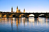 Spain, Aragon Region, Zaragoza Province, Zaragoza, Basilica de Nuestra Senora de Pilar and the Puente de Piedra on the Ebro River