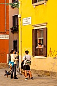 Italy, Veneto, Venice listed as World Heritage by UNESCO, venice inhabitants talking in the street