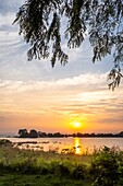 Sri Lanka, North Central Province, Polonnaruwa, sunset over Parakrama Samudra lake