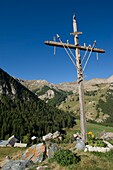 France, Hautes Alpes, Queyras massif, Saint Veran, cross of passion above the hamlet of Raux and the valley of Chatelard