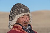 Mongolia, East Mongolia, Steppe area, Mongolian shepherd in traditional clothes