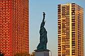 France, Paris, the banks of the Seine, the buildings of the Beaugrenelle district, the island of the swans with the Statue of Liberty