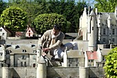 France, Indre et Loire, Loire valley listed as World Heritage by UNESCO, Amboise, Mini-Chateau Park, Guy Perier art maquetist in front of the model of the city of Loches