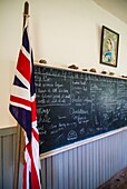 Canada, Prince Edward Island, Orwell, Orwell Corner Historic Village, Orwell School, b. 1895, interior with blackboard and portrait of British Queen Victoria