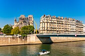 France, Paris, area listed as World heritage by UNESCO, Ile de la Cite, Notre Dame Cathedral and a boat