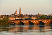 France, Gironde, Bordeaux, area listed as World Heritage by UNESCO, Pont de Pierre on the Garonne River, Pey-Berland tower and Saint Andre cathedral