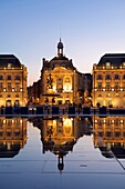 France, Gironde, Bordeaux, area listed as World Heritage by UNESCO, Saint Pierre district, Place de la Bourse (Square of Bourse), the reflecting pool from 2006 and directed by Jean-Max Llorca hydrant and the three graces fountain