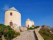 Windmills of Pandeli with Medieval Castle in the background, Leros Island, Dodecanese, Greek Islands, Greece, Europe