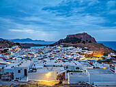 View over Lindos village towards the Acropolis at dawn, Rhodes Island, Dodecanese, Greek Islands, Greece, Europe