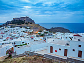 View over Lindos village towards the Acropolis, Rhodes Island, Dodecanese, Greek Islands, Greece, Europe