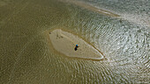 Aerial of a girl walking on a sandbank, Langebaan Lagoon Marine Protected Area, West Coast National Park, Western Cape Province, South Africa, Africa