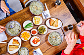 Typical South Korean dishes with abalone porridge, kimchi, side dishes and fresh fish, Jeju Island, South Korea, Asia