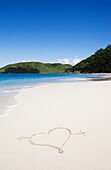 USA, United States Virgin Islands, St. John, Cinnamon Bay, Heart shape drawn in sand