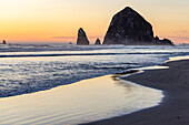 USA, Oregon, Silhouette of Haystack Rock at Cannon Beach at sunset