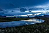 Reflection of evening storm in Silver Creek