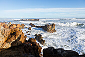 South Africa, Hermanus, Waves crashing against rocks on Kammabaai Beach