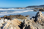 South Africa, Hermanus, Rocky coastline and sea at Voelklip Beach