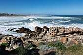 South Africa, Hermanus, Rocky coastline and sea at Onrus Beach