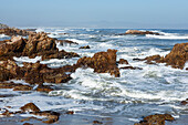 South Africa, Hermanus, Rocky coastline and sea at Kammabaai Beach
