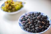Blackberries and Grapes in Ceramic Bowls
