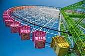 Giant Ferris Wheel Against Blue Sky