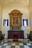 An elaborate altarpiece in a side chapel in the Cathedral of Santo Domingo in colonial Santo Domingo, Dominican Republic. Capilla de Nuestra Senora de la Luz, or the Chapel of Our Lady of the LIght. The Cathedral of Santa Maria La Menor was the first cathedral built in the Americas, completed about 1540 A.D. It is a Minor Basilica and is located in the old Colonial City of Santo Domingo. UNESCO World Heritage Site of the Colonial City of Santo Domingo.