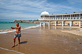 Middle-Aged Man Practices Tai Chi on La Caleta Beach, Cadiz