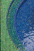 Marrakech, Morocco. Moorish tilework of a garden fountain.